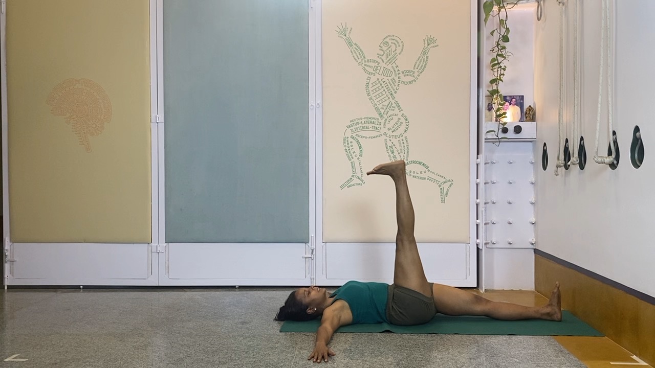 Progressions from Virabhadrasana1 to Twists, Abdominals and Inversions: Parivrtta parsvakonasana, Eka pada setubandha sarvangasana - Image 2