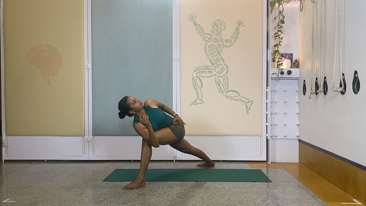 Progressions from Virabhadrasana1 to Twists, Abdominals and Inversions: Parivrtta parsvakonasana, Eka pada setubandha sarvangasana - Image 5