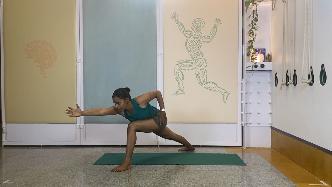 Progressions from Virabhadrasana1 to Twists, Abdominals and Inversions: Parivrtta parsvakonasana, Eka pada setubandha sarvangasana - Image 6